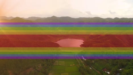 Video-of-rainbow-lines-over-moving-countryside-landscape