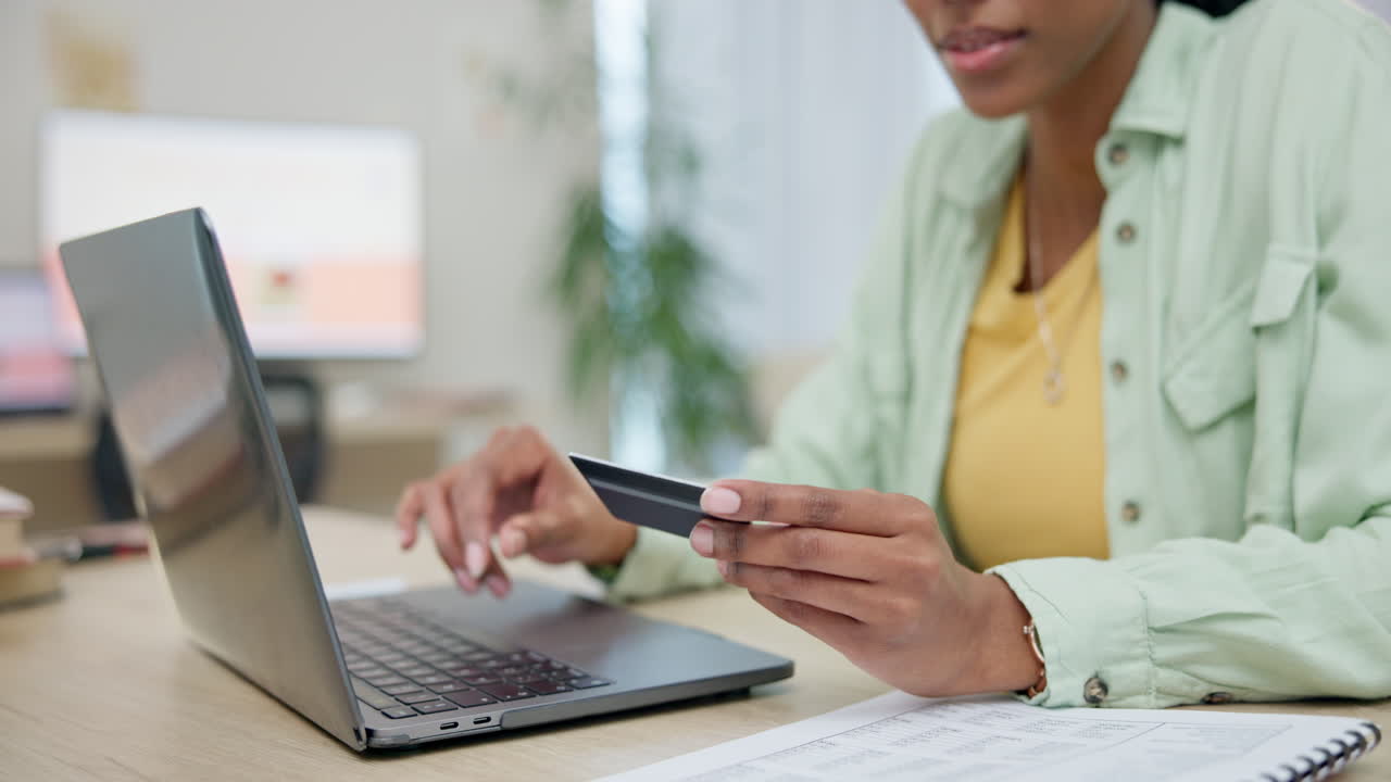 Hands, laptop and credit card