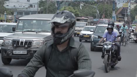 bustling indian street traffic with various vehicles and people