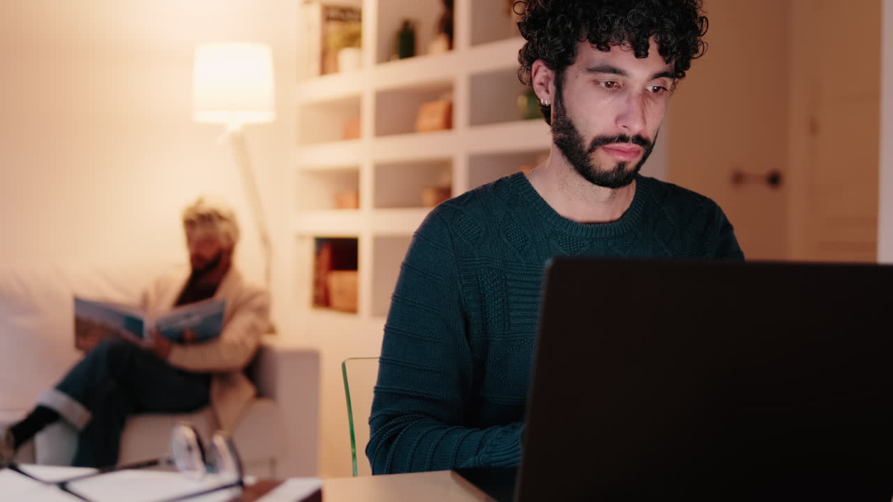 Gay Couple at Home: Working and Relaxing