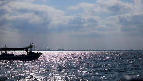 a boat sailing in the sea - fixed camera