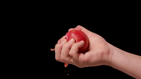 squeezing a tomato
