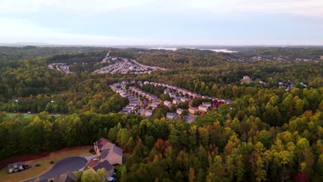 Housing-Communities-build-around-the-jungle,-Lush-green-housing-society,-tennis-court,-Lake-in-the-Background,-Urban-Development