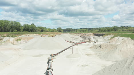 aerial view of conveyor belt in action at limestone quarry site