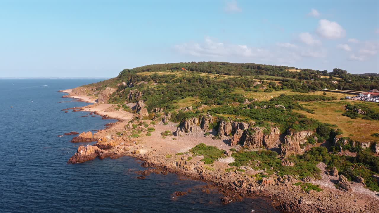 Rocky coastline at Hovs Hallar Nature Reserve, Sweden, with cliffs and blue sea views