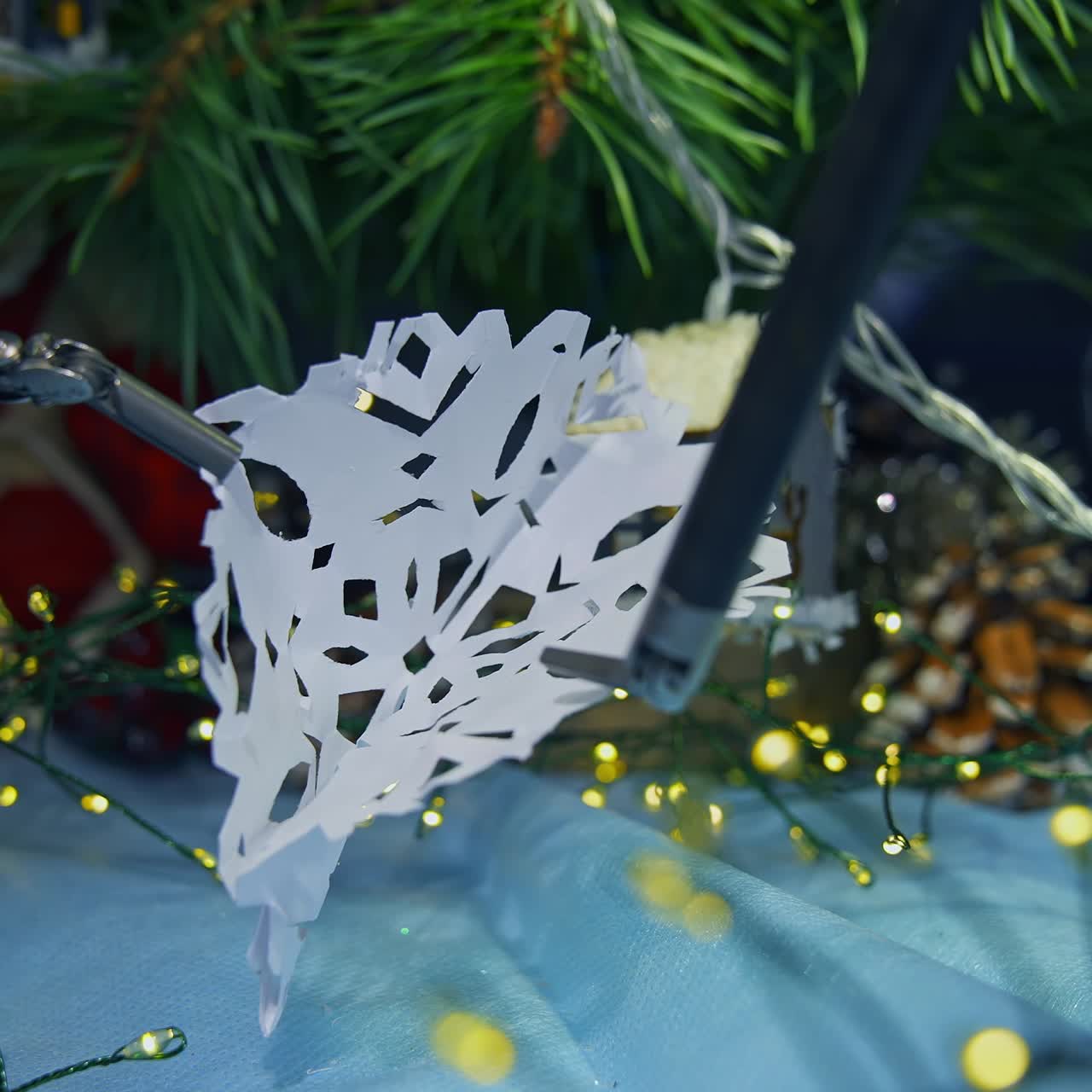 Modern robotic equipment for surgical operations unfold the paper clip. Christmas decorations with the help of innovative futuristic system. Close up