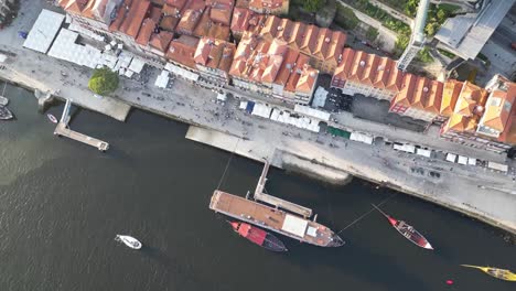 Drone-shot-looking-down-over-the-river-in-Porto-Portugal