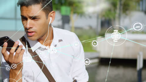 Animation-of-network-of-data-icons-over-biracial-man-talking-on-smartphone-outdoors
