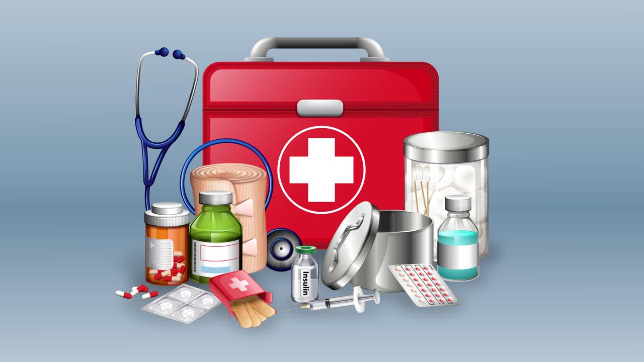 Various medical supplies arranged around a first aid kit
