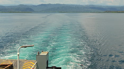 pov of the back of a boat cruising in the ocean in bocas del toro, panama