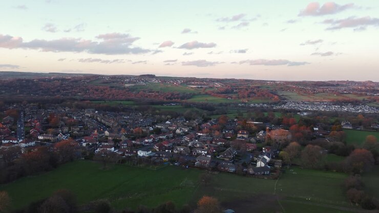 Rising Establishing Aerial Drone Shot Over Calverley Village Houses and Fields at Autumn Sunset in West Yorkshire UK