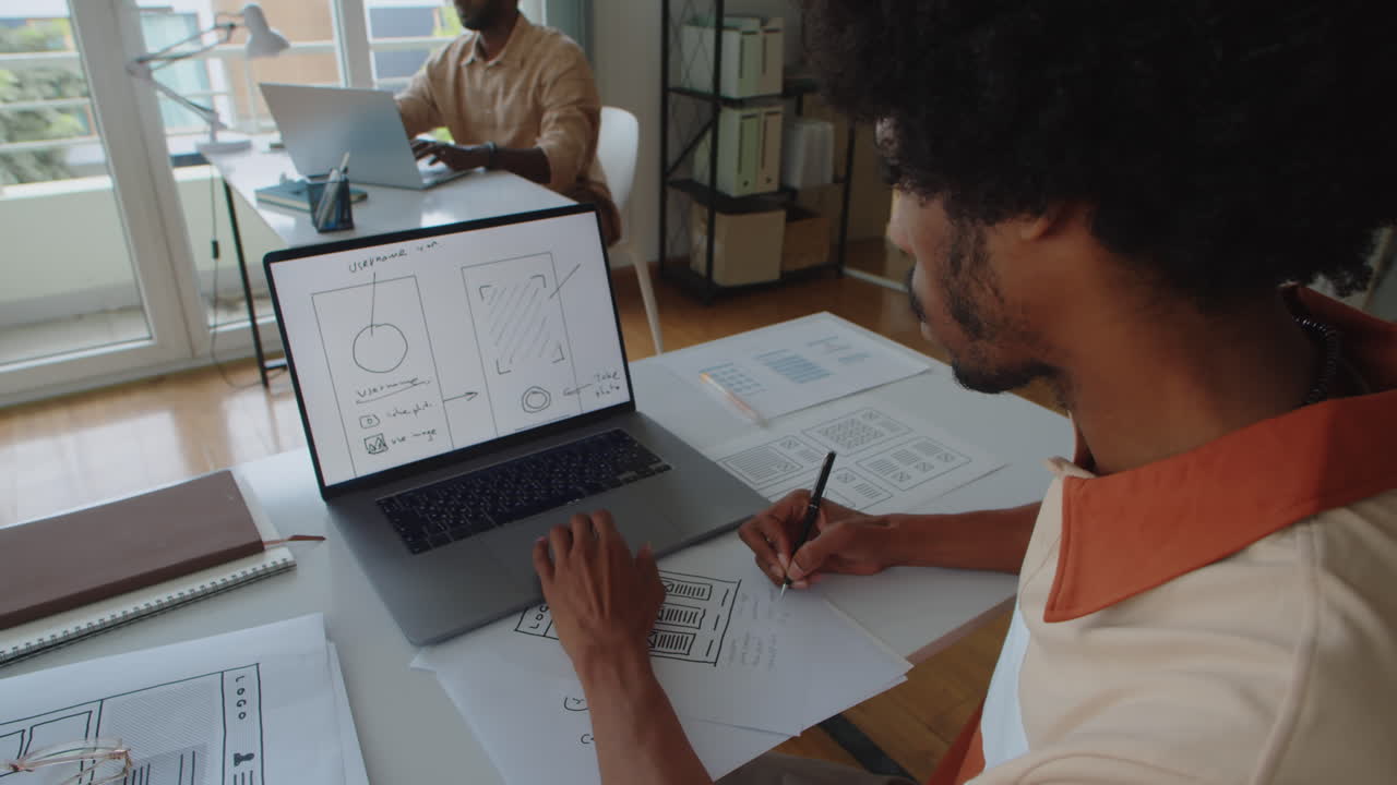 African American Graphic Designer Developing App Interface