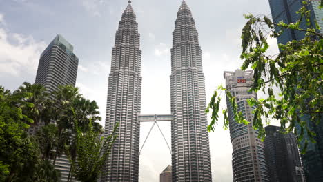 twin petronas giants in the kuala skies, reaching where the eagle flies