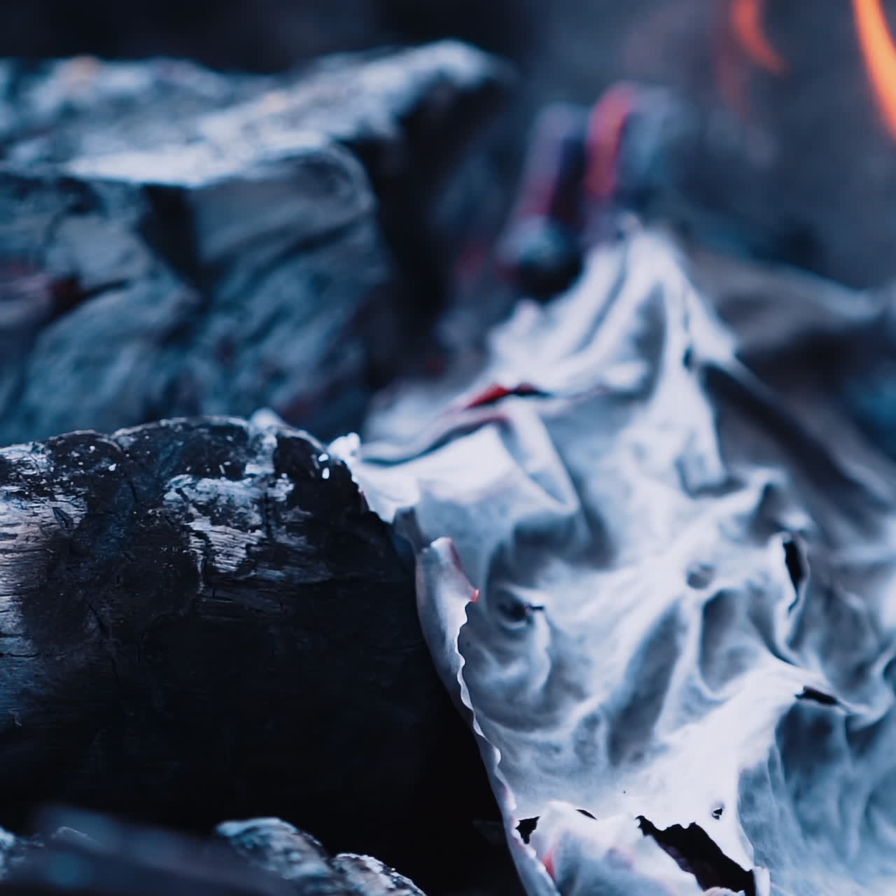 Burning paper. Bonfire. Burning logs in orange flames. Slow motion