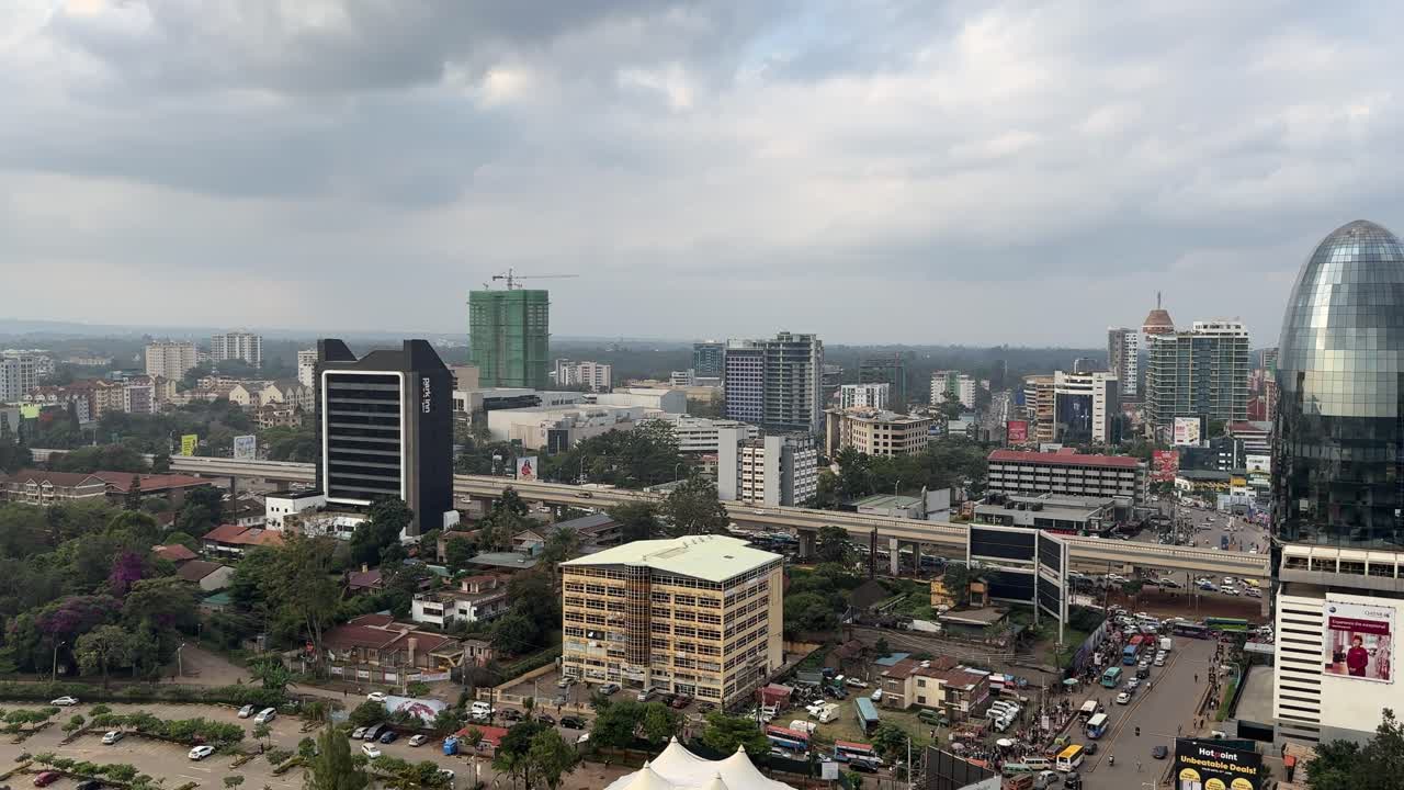 Cityscape view with buildings, roads, and sky