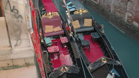 two gondolas in a venetian canal