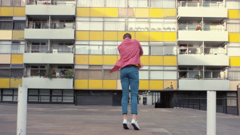 contemporary funky caucasian man street dancer dancing freestyle in the city