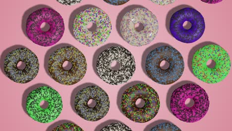 animación de rosquillas vidriadas de colores que aparecen en un fondo abstracto rosado