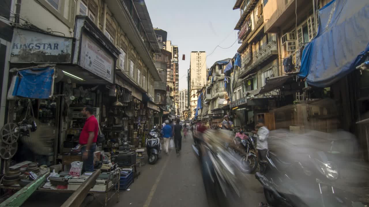 Hyper lapse or time lapse shot of a crowded lane of an Indian city.