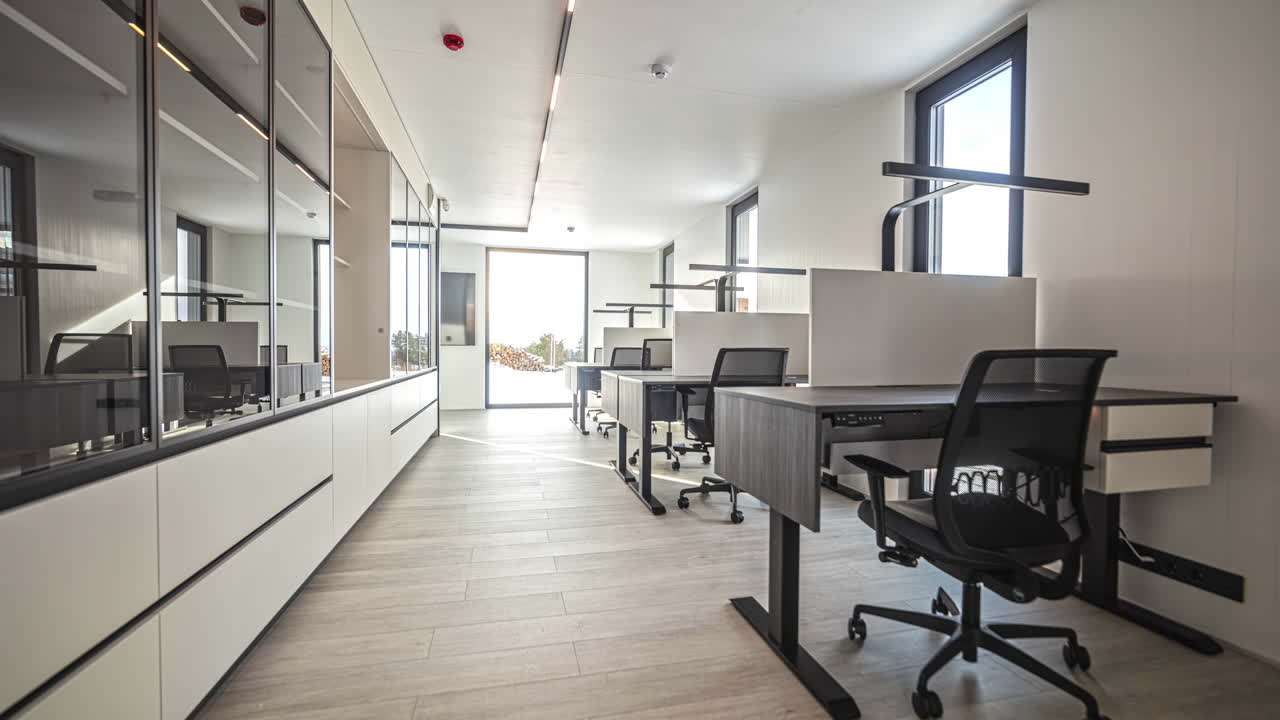 Modern Empty Office Space with Multiple Desks and Chairs