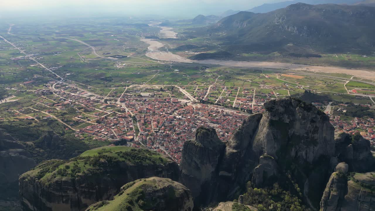 Mystic drone establishing of Meteora rocks and monastery in Kalambaka, Greece from high above