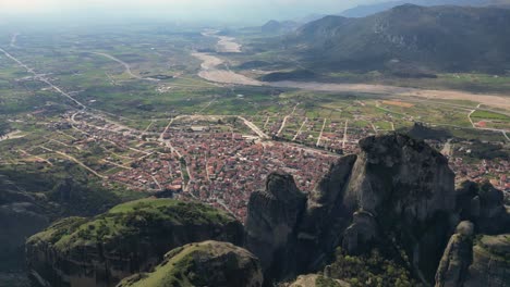 mystic drone establishing of meteora rocks and monastery in kalambaka, greece from high above