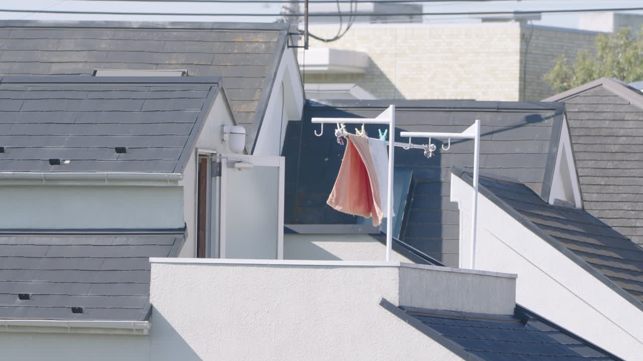 Laundry Towels Hanging On Clothesline And Billowing By Wind