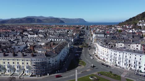 beachfront aerial view llandudno seaside coastal holiday town tourism resort hotels left panning shot