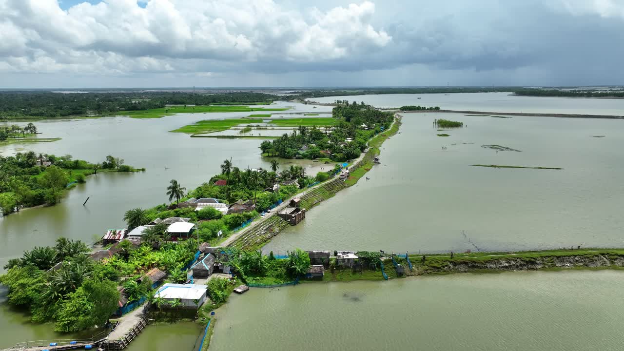 Aerial view of rural coastal village, agricultural fields submerged in flood, Satkhira region, Bangladesh