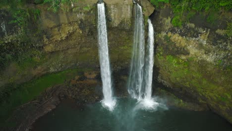 aerial slow reveal wide shot of opaekaa falls, daytime