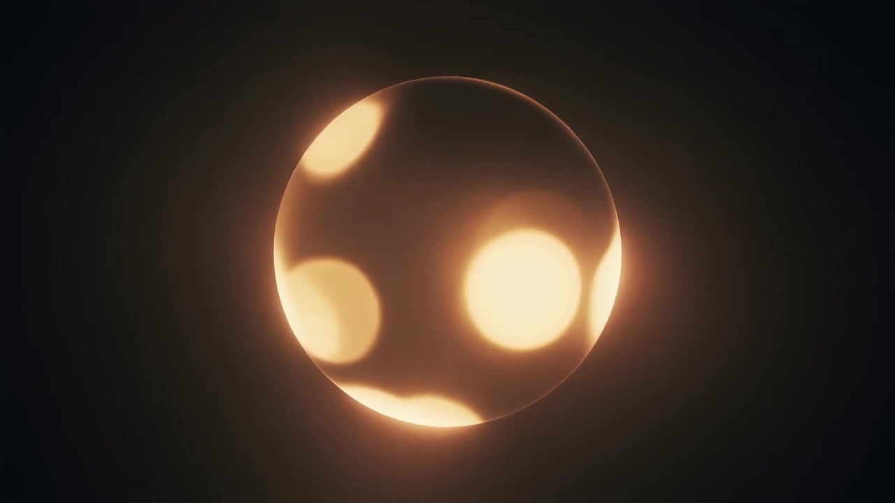 Abstract Glowing Golden Sphere with Floating Bokeh Light Particles