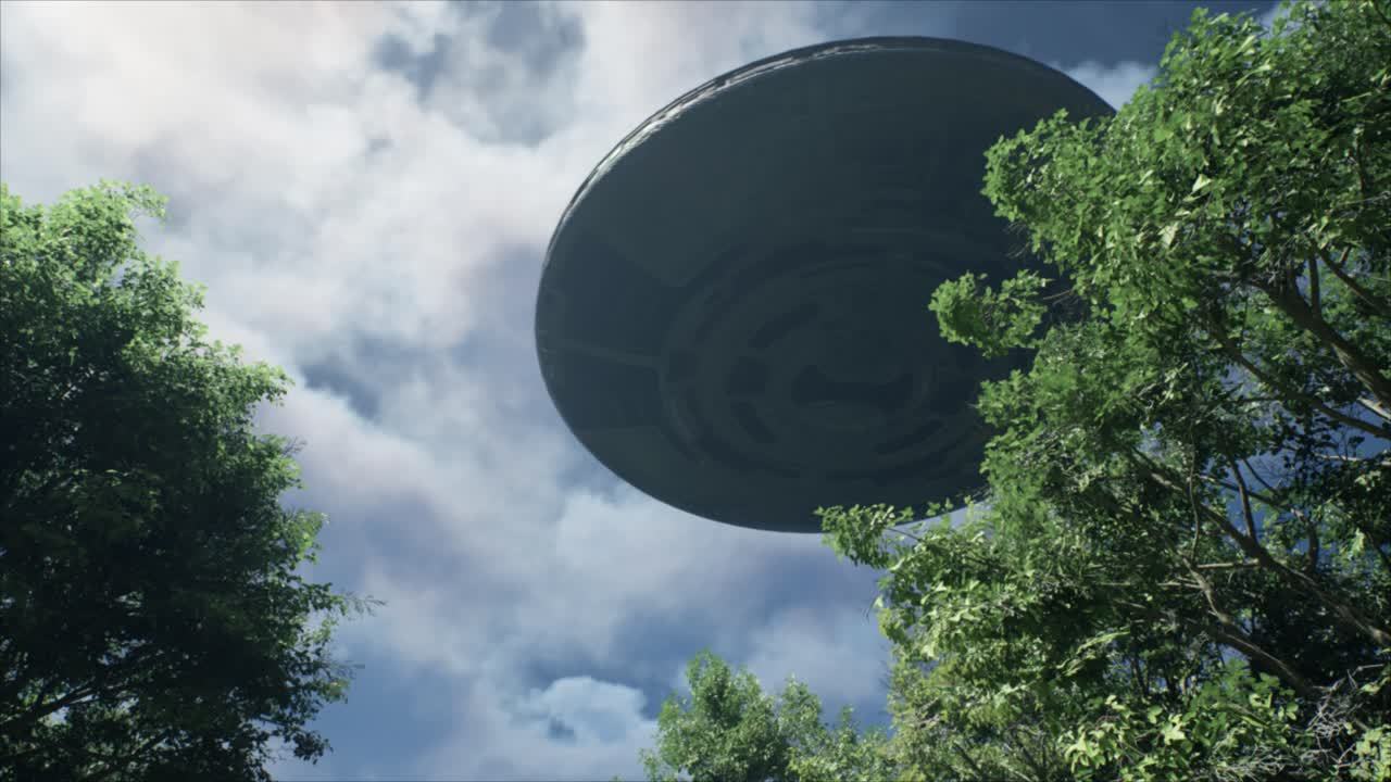Breathtaking view up through the canopy in a forest as a huge circular UFO flying saucer spins slowly overhead casting its ominous shadow over the trees below