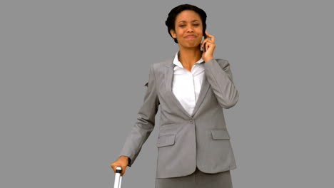 Late-woman-throwing-her-phone-on-grey-screen