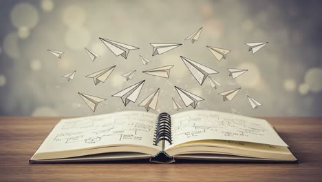 an inspiring journey: a notebook filled with ideas surrounded by floating paper airplanes symbolizing creativity and exploration of imagination