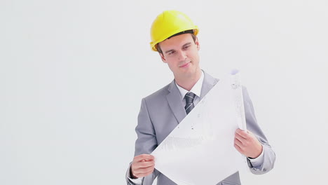 Smiling-architect-wearing-a-yellow-helmet