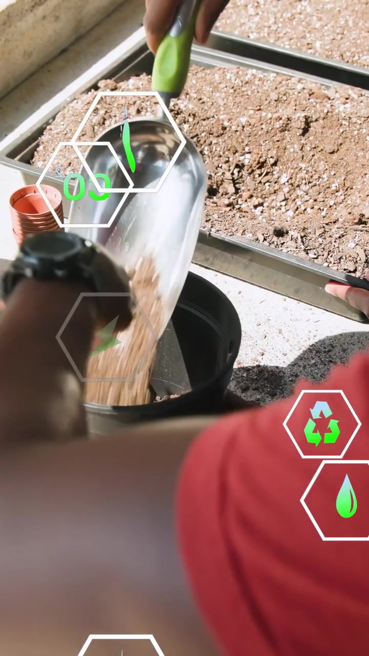 Vertical video: Man placing pot then scooping soil for garden, green hex icons showing over hands