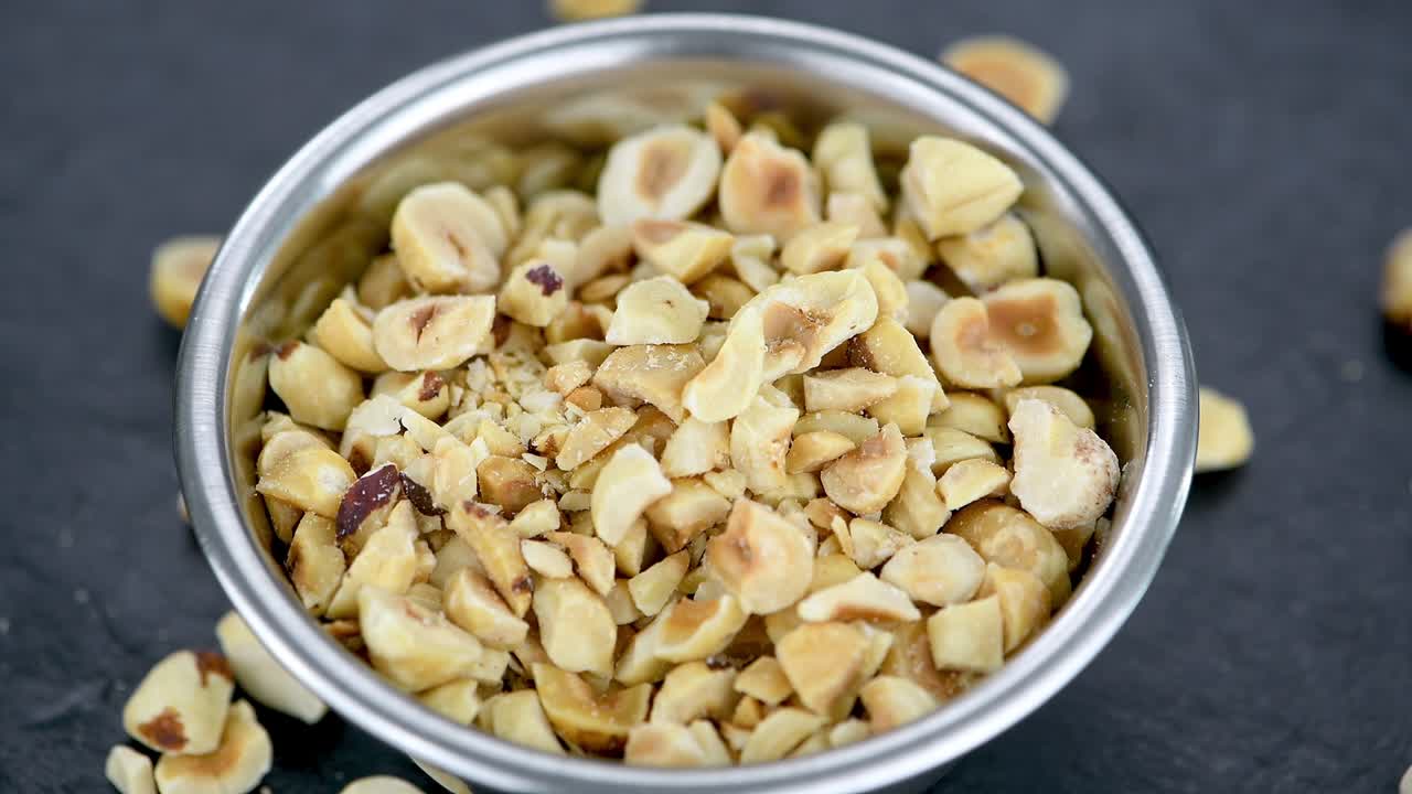 Chopped Hazelnuts on a rotating plate (seamless loopable)