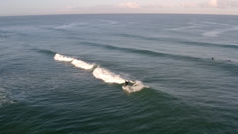 a surfer riding a wave in the ocean
