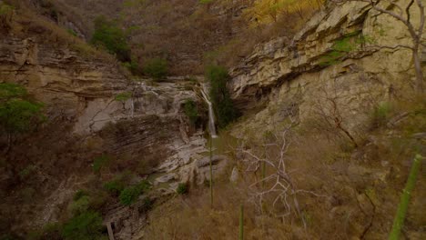 drone footage of a beautiful waterfal in the middle of the mexican desert