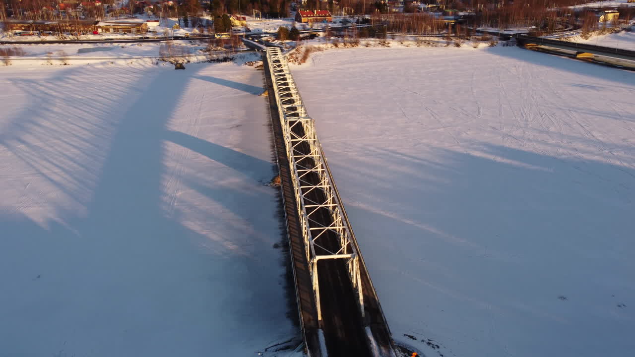 Aerial View Over Bridge During Winter In Tornio City, Finland - Drone Shot
