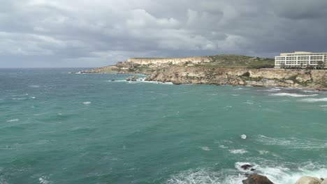 raging turquoise colour mediterranean sea in ghajn tuffieha bay during winter in malta