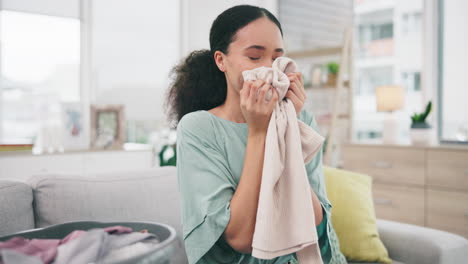 laundry, fabric and a woman smelling a scarf