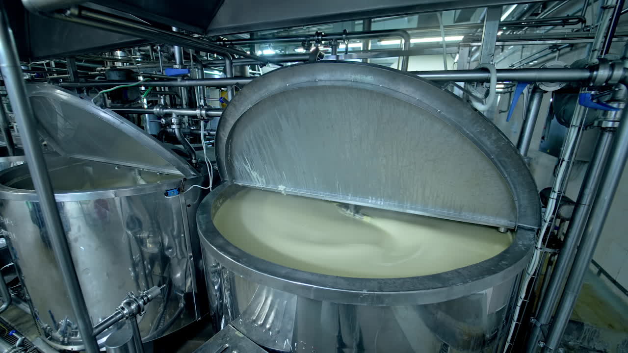 Big factory for making cheese. Producing dairy cheesemaking industry.