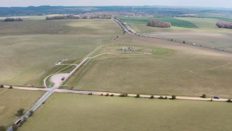 Dolly-forward-drone-shot-of-Stonehenge-towards-A303-highway