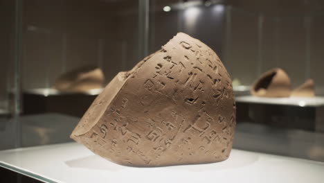 ancient clay vessel with inscriptions