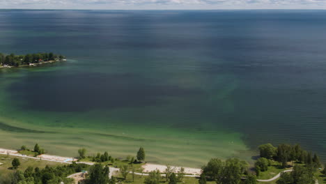 aerial parallax shot revealing the beautiful coastline of lake simcoe in ontario