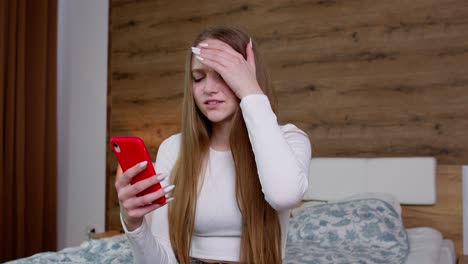 sad upset dissatisfied irritated girl reading bad news on mobile phone, unhappy after shopping