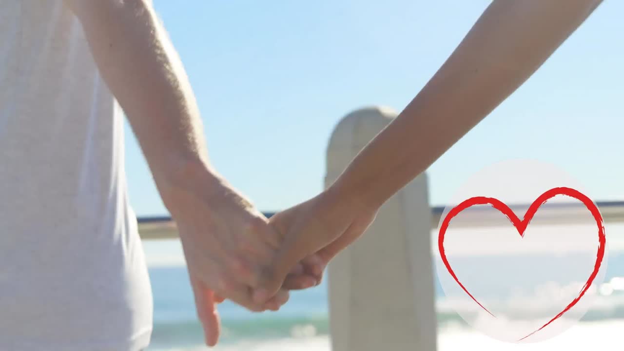 손을 잡고 있는 백인 부부 위에 있는 심장 아이콘의 애니메이션