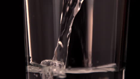 water pouring into a glass