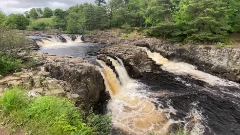 Still-Shot-of-Low-Force-Waterfall-in-Teesdale,-on-a-cloudy-summers-day